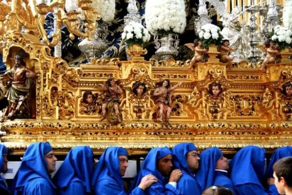 Cofrades carrying the Virgin on their shoulders during Holy Week in Malaga
