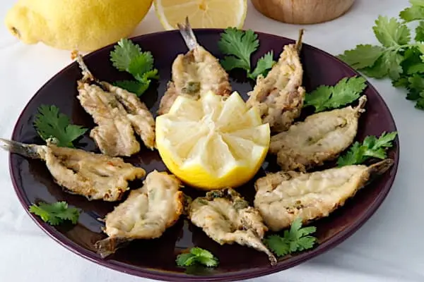 plate of fried anchovies with lime